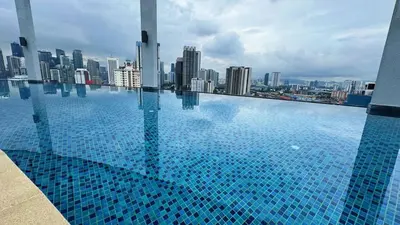 a large swimming pool on top of a city skyline at Jalan Ampang KLCC Embassy Area Homestay in Kuala Lumpur