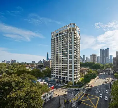a tall building in the middle of a city at Jalan Ampang KLCC Embassy Area Homestay in Kuala Lumpur