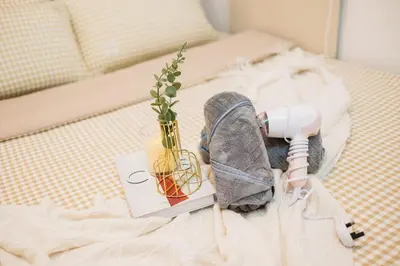 a stuffed animal on a bed with a lamp and a plant at Legasi Residence By Feel Home in Kuala Lumpur