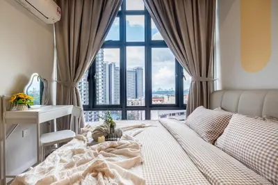 a bedroom with a bed and a large window at 38 Bangsar by Feel Home in Kuala Lumpur
