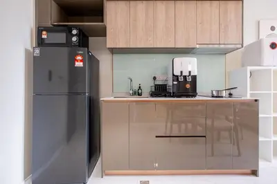 a kitchen with a stainless steel refrigerator in a kitchen at 38 Bangsar by Feel Home in Kuala Lumpur