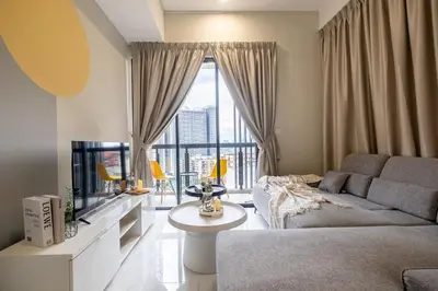 a living room with a couch and a tv at 38 Bangsar by Feel Home in Kuala Lumpur