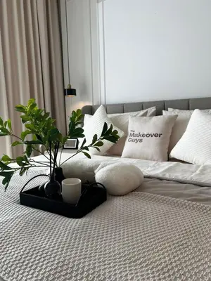 a bed with a tray with a plant on it at Modern Studio Escape in Kuala Lumpur