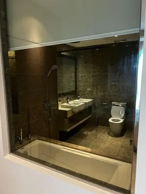 a bathroom with a tub and a toilet and a sink at Modern Studio Escape in Kuala Lumpur