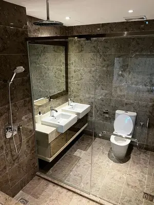 a bathroom with a toilet and a sink and a shower at Modern Studio Escape in Kuala Lumpur