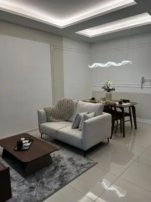a living room with a couch and a table at Modern Studio Escape in Kuala Lumpur
