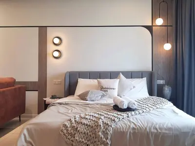 a bedroom with a bed with two towels on it at Cozy Studio Retreat in Kuala Lumpur