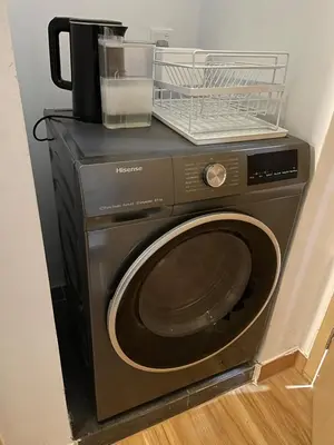 a washing machine with a basket on top of it at Cheapest 2R2B in the Heart of KL in Kuala Lumpur