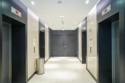 a hallway with a door in a building with a hallway sidx sidx at The Colony Infinitum by Manila in Kuala Lumpur