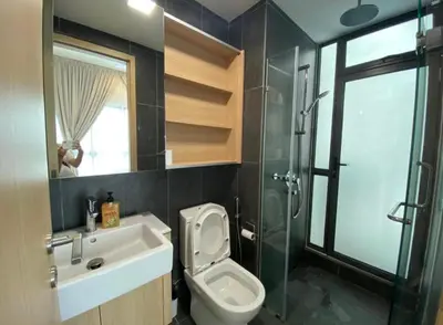 a bathroom with a toilet and a sink and a shower at The Colony by Klcc Wisma Infinitum in Kuala Lumpur