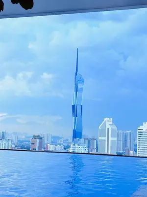 a view of a city skyline from a swimming pool at THE Colony KL at Sky World in Kuala Lumpur