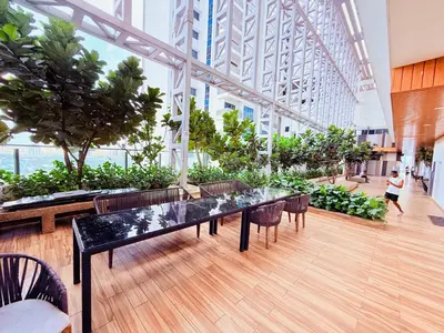 a large room with tables and chairs in a building at THE Colony KL at Sky World in Kuala Lumpur