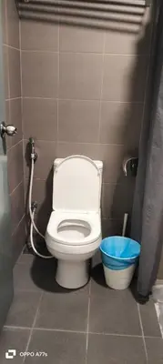 a bathroom with a white toilet in a stall at Summer suite KLCC by Classic Stay in Kuala Lumpur