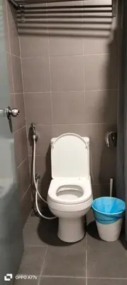 a bathroom with a white toilet in a stall at Summer suite KLCC by Classic Stay in Kuala Lumpur