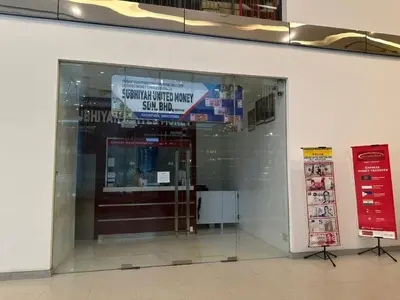 a store entrance with a sign in a building at Mercu Summer Suites By comfort Home Stay in Kuala Lumpur