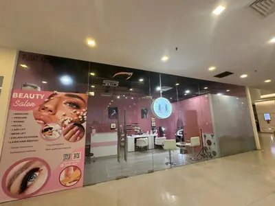 a store window with avertisement for a donut shop at Mercu Summer Suites By comfort Home Stay in Kuala Lumpur