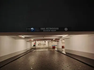 a long hallway with a sign in a subway station at Sky Suites Apartment service in Kuala Lumpur