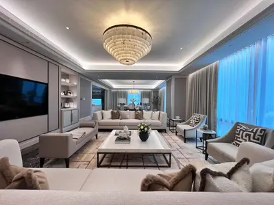 a living room with couches and a tv at Apartment Sixceylon City Centre in Kuala Lumpur