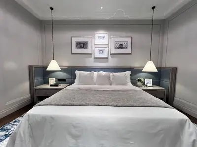a bedroom with a large bed with two night stands at Apartment Sixceylon City Centre in Kuala Lumpur