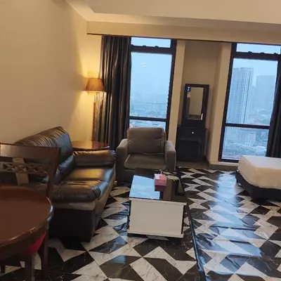 a living room with a couch and a table at Home land apartment by Times Square in Kuala Lumpur