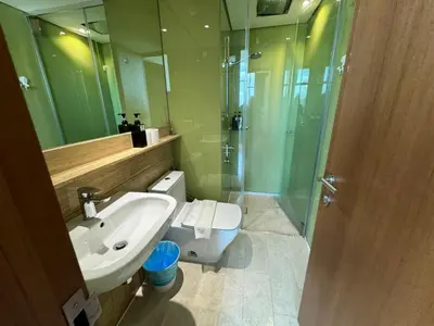 a bathroom with a toilet and a sink and a shower at Tomato Homestay in Kuala Lumpur