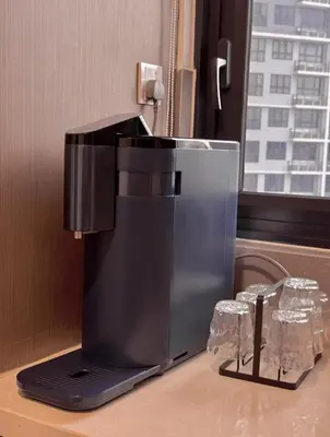 a coffee machine sitting on a counter in a room at Friendly & Cozy Near TRX & Pavilion in Kuala Lumpur