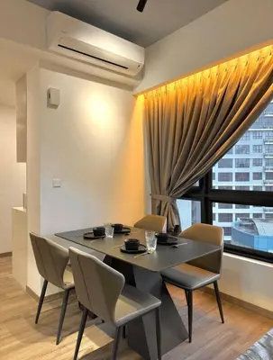 a dining room with a table and chairs and a window at Friendly & Cozy Near TRX & Pavilion in Kuala Lumpur