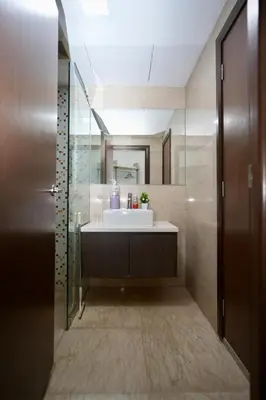 a bathroom with a sink and a mirror at Willow Home in Kuala Lumpur
