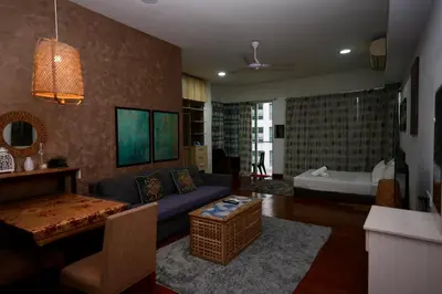 a living room with a couch and a table at Willow Home in Kuala Lumpur