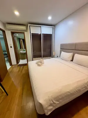 a bedroom with a large white bed in a room at Vortex suites klcc by ARICA in Kuala Lumpur