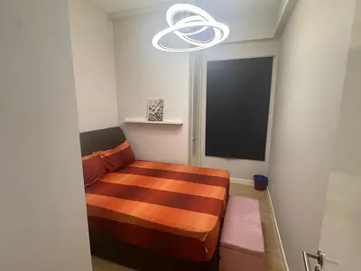 a bedroom with a bed in a room with a window at Desa green unit in Kuala Lumpur