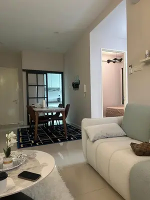 a living room with a couch and a table at Desa green unit in Kuala Lumpur
