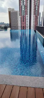 a swimming pool in a city with tall buildings at Chambers suites KLCC by Infinity in Kuala Lumpur
