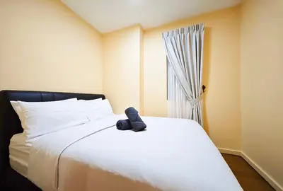 a teddy bear sitting on top of a bed at Bukit Bintang Fairlane Residence #1810 Kuala Lumpur in Kuala Lumpur