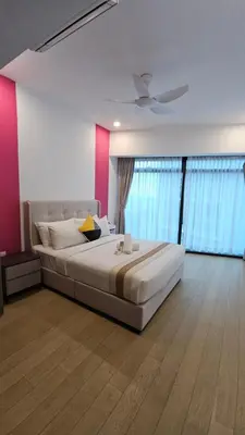 a bedroom with a large bed and a ceiling fan at Crystal Exclusive Suites KLCC in Kuala Lumpur