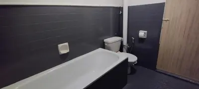 a bathroom with a toilet and a bath tub at Segambut House near MITEC KLCC PWTC 14 paxs in Kuala Lumpur