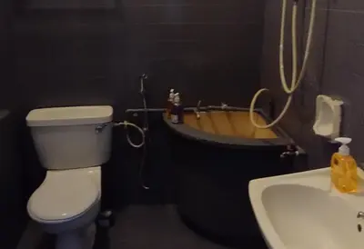 a bathroom with a toilet and a sink and a tub at Segambut House near MITEC KLCC PWTC 14 paxs in Kuala Lumpur