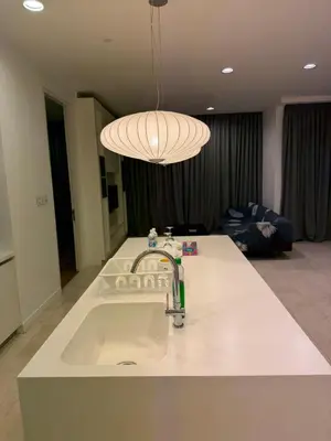 a kitchen counter with a sink and a light at Platinum kuala lumpur by Bright Suites in Kuala Lumpur