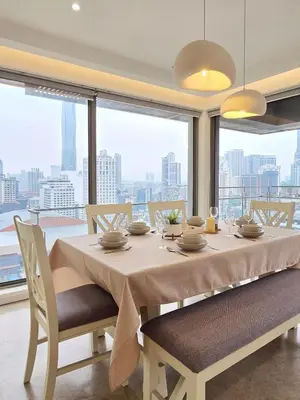 a dining room table with chairs and a large window at Panoramic KL View Bintang Fairlane Residence 3BR #21 in Kuala Lumpur