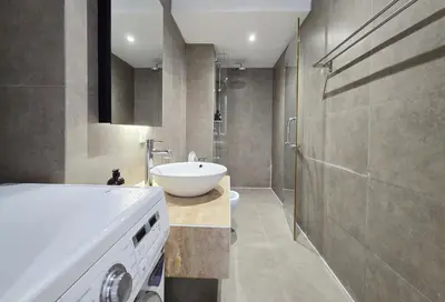 a bathroom with a white sink and a shower at Panoramic KL View Bintang Fairlane Residence 3BR #21 in Kuala Lumpur
