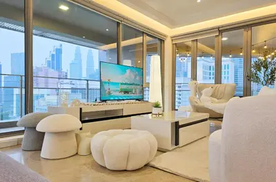 a living room with a tv and a large window at Panoramic KL View Bintang Fairlane Residence 3BR #21 in Kuala Lumpur