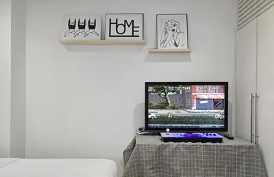 a television sitting on a table in a room at Panoramic KL View Bintang Fairlane Residence 3BR #21 in Kuala Lumpur