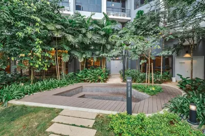 a courtyard with a fountain in front of a building at Deluxe 2BR Agile Bukit Bintang by RumaBnB in Kuala Lumpur