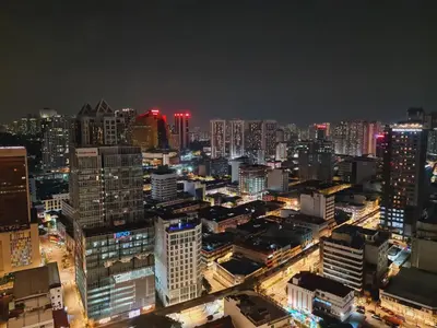 a view of a city at night at Home For Traveler At Majestic Residence in Kuala Lumpur