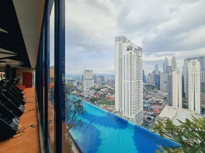 a balcony with a view of a city at Home For Traveler At Majestic Residence in Kuala Lumpur