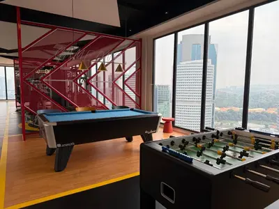 two pool tables in a room with a view at KLCC Majestic Residence By Vglory Home in Kuala Lumpur