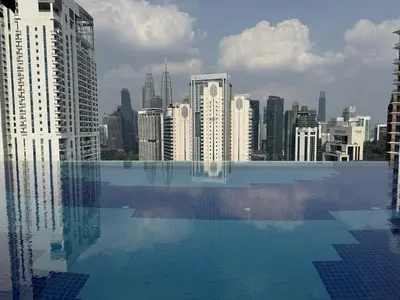 a swimming pool with a view of a city at KLCC Majestic Residence By Vglory Home in Kuala Lumpur