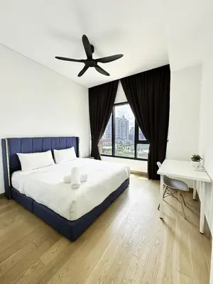 a bedroom with a bed and a ceiling fan at Lucentia Universal Stay Kuala Lumpur in Kuala Lumpur