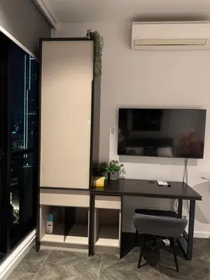 an office with a black desk and a window at KLCC View Suites By Scarletz in Kuala Lumpur