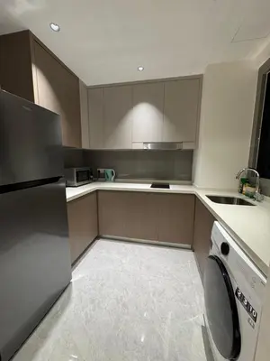 a kitchen with a washer and a dishwasher at KLCC View Suites By Agile in Kuala Lumpur